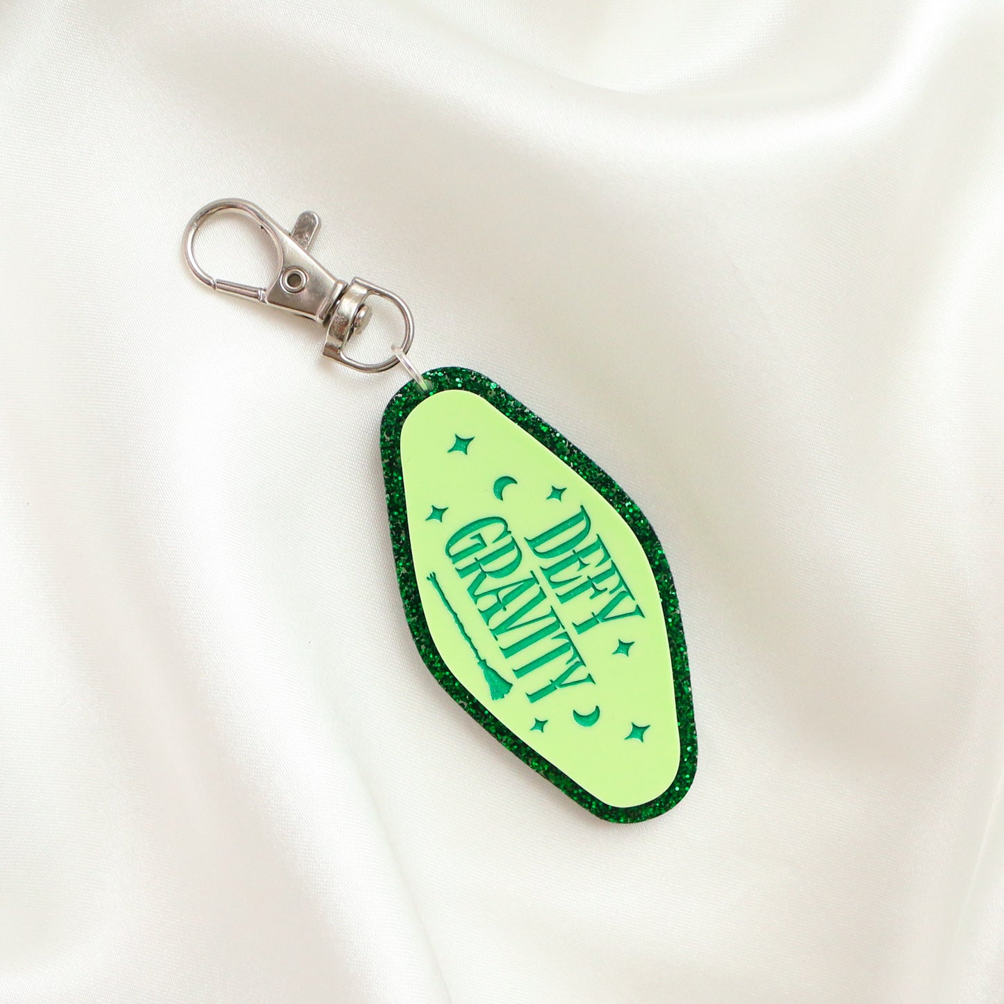 Defy Gravity glitter keyring